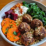 Close-up view of a vibrant Winter Buddha Bowl filled with colorful vegetables and grains.