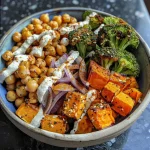 Close-up view of roasted vegetables drizzled with creamy tahini-yogurt dressing.