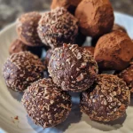Close-up view of a sugar-free chocolate truffle with a glossy finish.