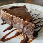 Close-up of a dessert pan filled with layers of sugar-free chocolate cream and a crumbly crust.