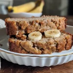 Side view of moist almond flour banana bread with a golden crust.