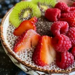Close-up of a creamy chia pudding topped with fresh berries.