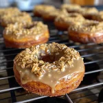 Close-up of Banana Oat Donuts on a plate with a golden-brown texture.