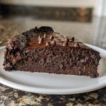 Close-up side view of a moist chocolate banana cake showcasing layers and texture.