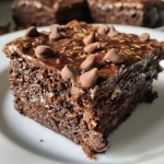 Close-up side view of a delicious chocolate oat cake with a moist texture.