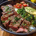 Close-up view of a Garlic Butter Steak Protein Bowl featuring juicy steak and vibrant vegetables.