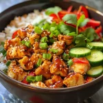Close-up view of a colorful Easy Sweet Chili Chicken Bowl with ingredients arranged attractively.