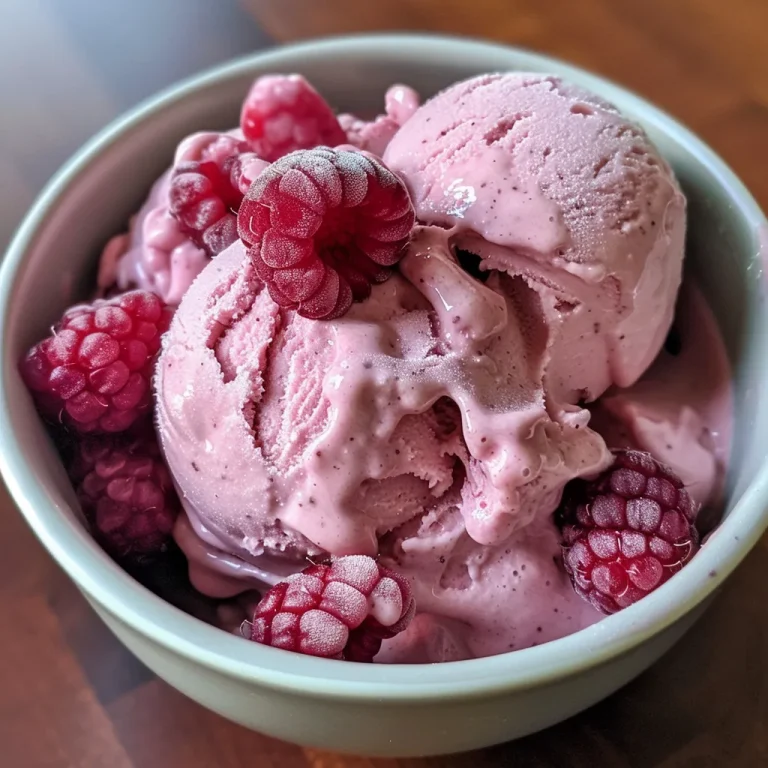 Close-up view of creamy protein berry ice cream with raspberries and banana.
