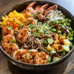 A vibrant Teriyaki Shrimp Soba Noodle Bowl with colorful vegetables and shrimp.