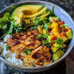 ['Close-up shot of a chicken and rice bowl with colorful toppings.', 'Side view of a delicious chicken and rice bowl showcasing its ingredients.', 'Juicy chicken and rice served with fresh vegetables and salsa.', 'Vibrant chicken and rice bowl featuring diced avocado and chopped romaine.']