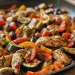 ['A close-up of a colorful Mediterranean chicken stir-fry showcasing juicy chicken, bell peppers, zucchini, and olives.', 'Side view of a vibrant chicken stir-fry with a variety of vegetables, highlighting the texture and freshness of the ingredients.', 'A detailed shot of Mediterranean chicken stir-fry featuring sliced chicken breast, bell peppers, and zucchini, garnished with olives.', 'Close-up image of a delicious Mediterranean chicken stir-fry, highlighting the bright colors of the vegetables and tender chicken pieces.']