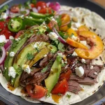 ['Close-up of a colorful summer peach wrap with roast beef and fresh ingredients.', 'Side view of a wrapped flatbread filled with peach, beef, and vibrant veggies.', 'Juicy peach wraps with sliced beef, avocado, and herbs laid out on a plate.', 'Delicious summer wraps showcasing layers of peaches, roast beef, and fresh salad.']