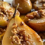 ['Close-up view of healthy baked pears sprinkled with cinnamon and crushed nuts.', 'Side view of juicy baked pears, drizzled with syrup and topped with walnuts.', 'Deliciously baked pears, golden brown and garnished with walnuts and cinnamon.', 'Appetizing baked pears with a sprinkle of cinnamon and a touch of maple syrup.']