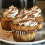 ['Side view of a delicious Keto Spice Cake Cupcake with a creamy frosting.', 'Close-up of a moist Keto Spice Cake Cupcake topped with cream cheese frosting.', 'Juicy Keto Spice Cake Cupcake showcasing a textured exterior and smooth frosting.', 'Detailed view of a Keto Spice Cake Cupcake with spices sprinkled on top.']