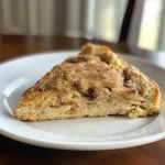 ['Close-up of golden-brown Air Fryer Cinnamon Chip Scones with glistening cinnamon chips.', 'Side view of fluffy Air Fryer Cinnamon Chip Scones, highlighting their crispy exterior and soft interior.', 'Juicy Air Fryer Cinnamon Chip Scones sprinkled with sparkling sugar, showing off cinnamon chips.', 'Deliciously baked Air Fryer Cinnamon Chip Scones, emphasizing their rich golden color and texture.']